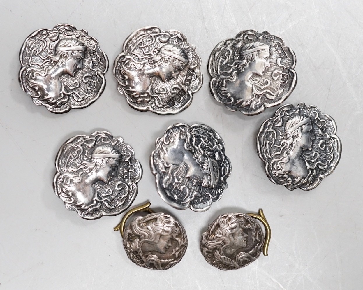 A set of six Edwardian silver buttons, S.M. Levi, Birmingham, 1902, 20mm, two other buttons and a cased set of six George V silver and enamel buttons.